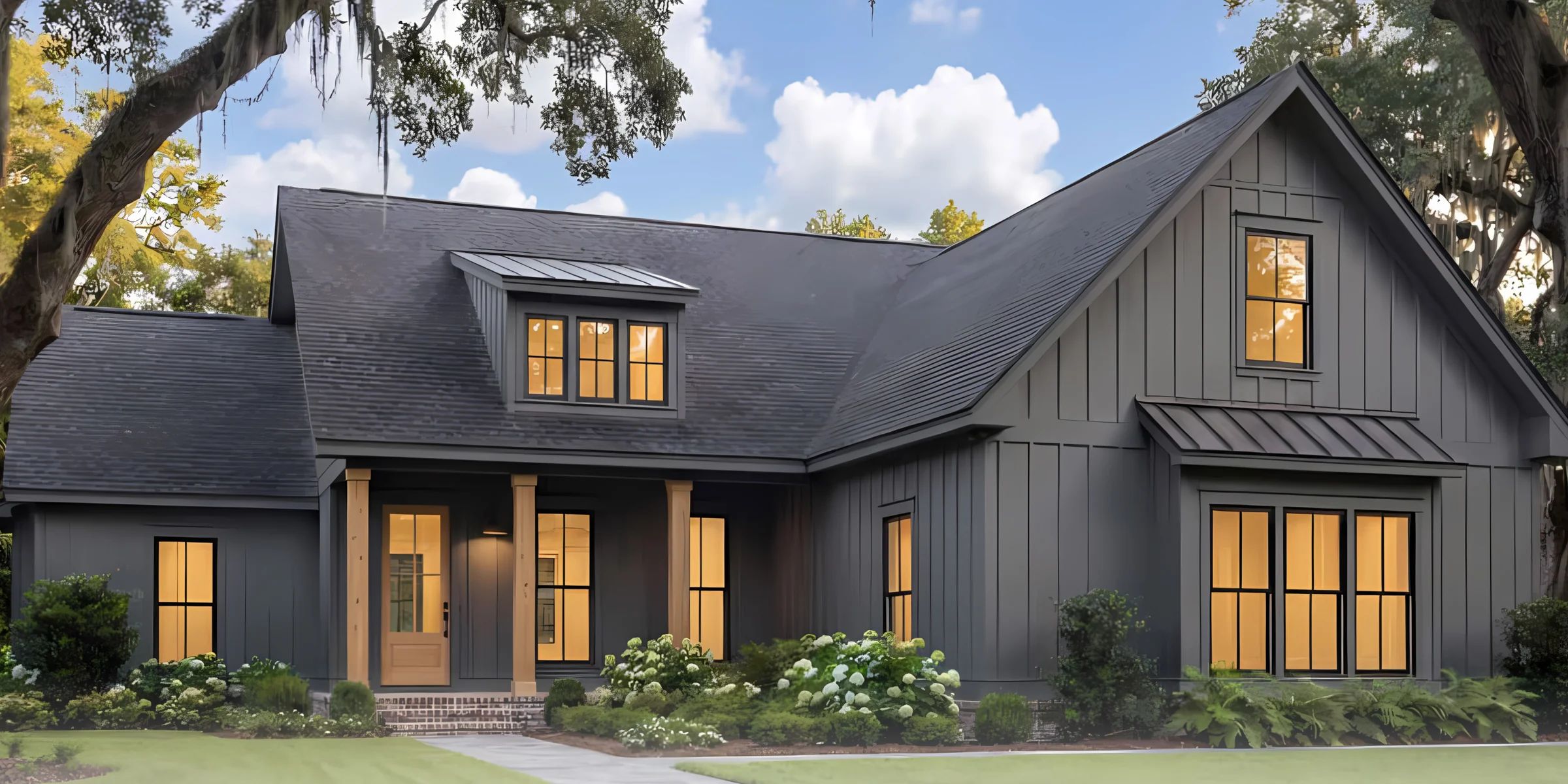 Architectural rendering of a dark gray home with a covered front porch and warm interior lighting.